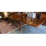 A fine large George IV period Dining Table, with two pull out end sections for resting extra leaves,