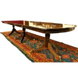 An attractive George III style mahogany triple pod Dining Table,