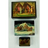 A collection of three graduating colourful decorated Russian lacquered Boxes, by Fedoskino,