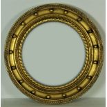 A 19th Century gilt Convex Mirror, in ball and rope moulded frame, 69cms (27")d.