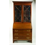 An Edwardian inlaid mahogany Bureau Bookcase, in the Georgian style,