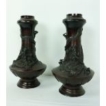 A pair of Japanese Meiji period (1868 - 1912) heavy bronze tubular Vases,