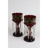 A pair of Victorian ruby glass Lustre Vases, with spear shaped drops, 14 1/4" (36.5cms).