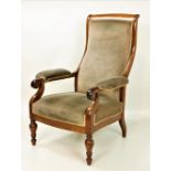 A Victorian walnut Armchair, with shaped back, over upholstered scroll arms, over turned front legs,