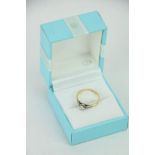 An elegant 18ct yellow gold and platinum Ladies Tiffany style Engagement Ring, with .