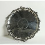 An Edwardian English silver Salver or circular Tray, with moulded border,