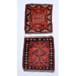 Two similar Afghan Prayer Rugs, one with centre square medallion on an iron red ground,