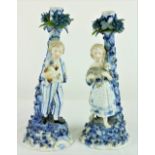 A pair of blue and white Sitzendorf Candlesticks, one of young girl holding a kid goat,