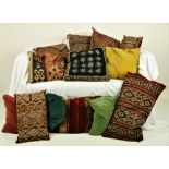 A collection of 7 various Persian Cushions, and other soft fabric cushions,