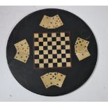 A circular 19th Century slate Table Top, with central inset games board, with playing cards, approx.