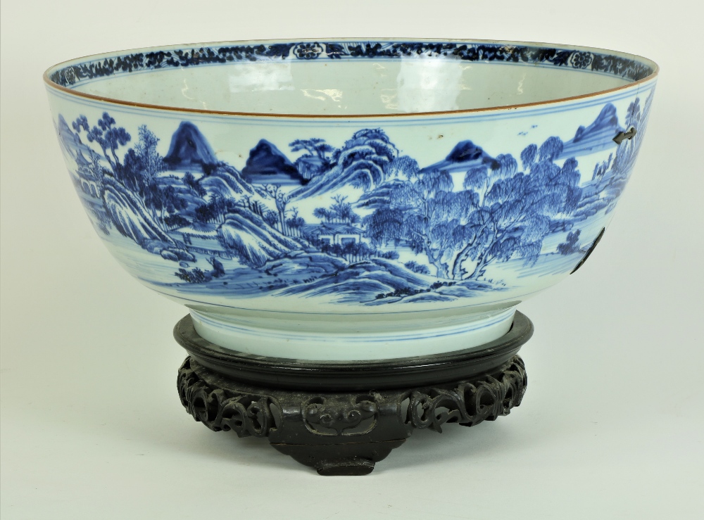 A large 18th Century Chinese blue and white Bowl, the outside with exterior scenes,