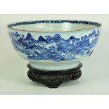 A large 18th Century Chinese blue and white Bowl, the outside with exterior scenes,