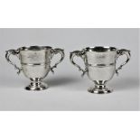 A pair of 18th Century Irish two handled Loving Cups, with shaped "S" scroll handles,