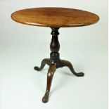 A George III flip top circular mahogany Tea Table, on turned stem and tripod base, 25" (74cms).