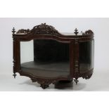 A 19th Century French carved walnut wall mounted bombé shaped Vitrine,