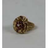 An attractive and unusual design ruby and diamond set gold Ring,