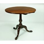 A 19th Century Irish mahogany circular flip top Table, on turned pillar support,