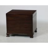 A small Georgian style mahogany Coal Box, with hinged cover on ogee bracket feet,