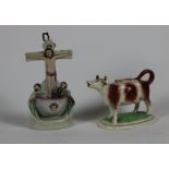 A 19th Century Staffordshire Cow Creamer, with cover, on oval base, 6 1/2" (16.