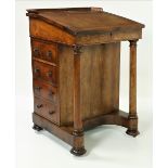 A William IV period rosewood and grained rosewood Davenport, attributed to Williams & Gibton,