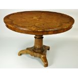 An unusual 19th Century and circular walnut Breakfast Table, with segmented top,