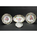 A pair of colourful Dresden Plates, decorated with flowers inside a pierced serpentine border,