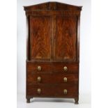 A Regency period mahogany Gentleman's Linen Cupboard,