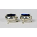 A pair of Victorian silver Salts, with gadroon edge on shell decorated pad feet, with liners,