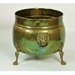 A 19th Century brass Fuel Bucket, of bulbous shape with lion mask handles on paw feet.