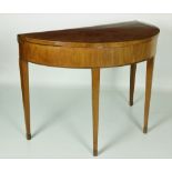 A Georgian period mahogany demi-lune fold-over Card Table, with inlaid sunburst top,