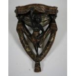 A good quality 19th Century polychrome and parcel gilt Blackamoor wall mounted Console Bracket,