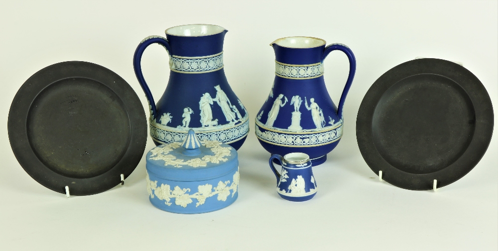 Two similar blue and white Wedgwood Jasperware Jugs, a similar Butter Dish and Cover,