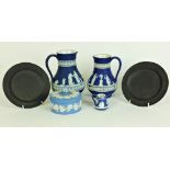 Two similar blue and white Wedgwood Jasperware Jugs, a similar Butter Dish and Cover,
