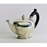 A fine quality 18th Century silver bullet Teapot, with engraved body decorated with shell motifs,