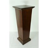 A mahogany Plinth, with square top on tapering body on plinth base, 91cms (36") high.