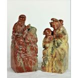A pair of 19th Century carved Soapstone Bookends, depicting typical Chinese Figures, each approx.