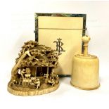 A fine quality 19th Century carved ivory Village Scene with multiple figures working in a mill,