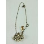 An 18ct gold and platinum Pendant, with eight round pearls and old cut diamonds (damaged, as is, w.