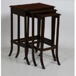 A nest of three inlaid mahogany graduating Tables, with front outsplayed legs.