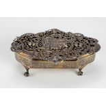 An attractive pierced decorated silver shaped Box, designed with horse drawn carriage, bells,