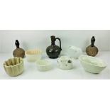 Four antique Jelly Moulds, a 19th Century white porcelain Shell Vase,