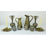 A set of four brass Chamber Sticks, four varied brass assimilated leather Water Jugs,