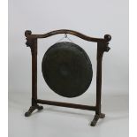 A very large 19th Century oak Gong in the Chinese style, with scroll finials,