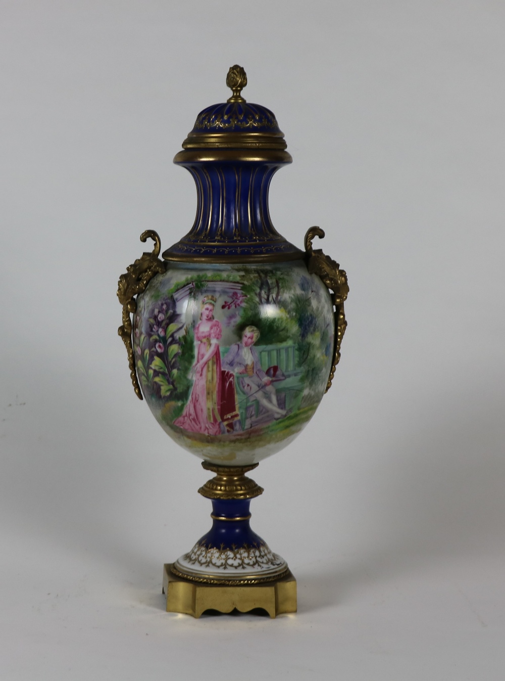 A Serves style brass mounted porcelain Vase and cover,