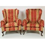 A pair of Georgian style wing back Armchairs,