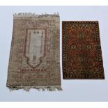 An Indian Prayer Rug, (treated cotton) the ivory ground inside four borders,