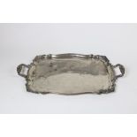 A very heavy two handled silver Tray, of shaped rectangular form, with shell decorated handles,