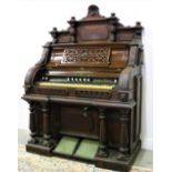 A Victorian walnut cased Musical Organ, with carved and pierced body, by J.F. Jones & Co.