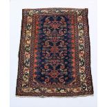 A Hamadan Village Rug, with dark blue and rust ground with stylized motifs,inside an ivory border,