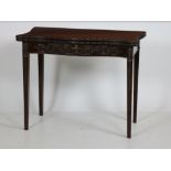 A serpentine shaped 19th Century mahogany fold-over Card Table,